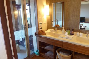 The bathroom has two sinks and a large shower that connects directly to the balcony and private hot bath!&nbsp;