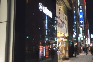 By night, Yamaha Ginza building&#39;s gleaming facade tastefully blends into the upscale Ginza&nbsp;cityscape.
