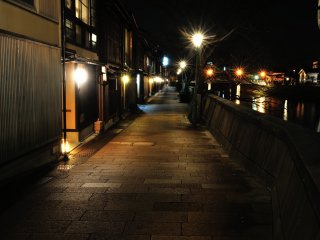 The stone-paved street along Asano River in Kazue-machi Town retains the shadow of its former self