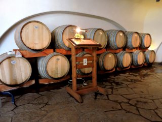 Stacked barrels bear the entrance of Akafuji Wine Cellar