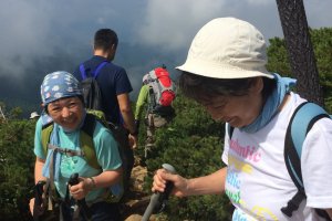 Hikers make a descent after a rest on top of Mt. Shibutsu.