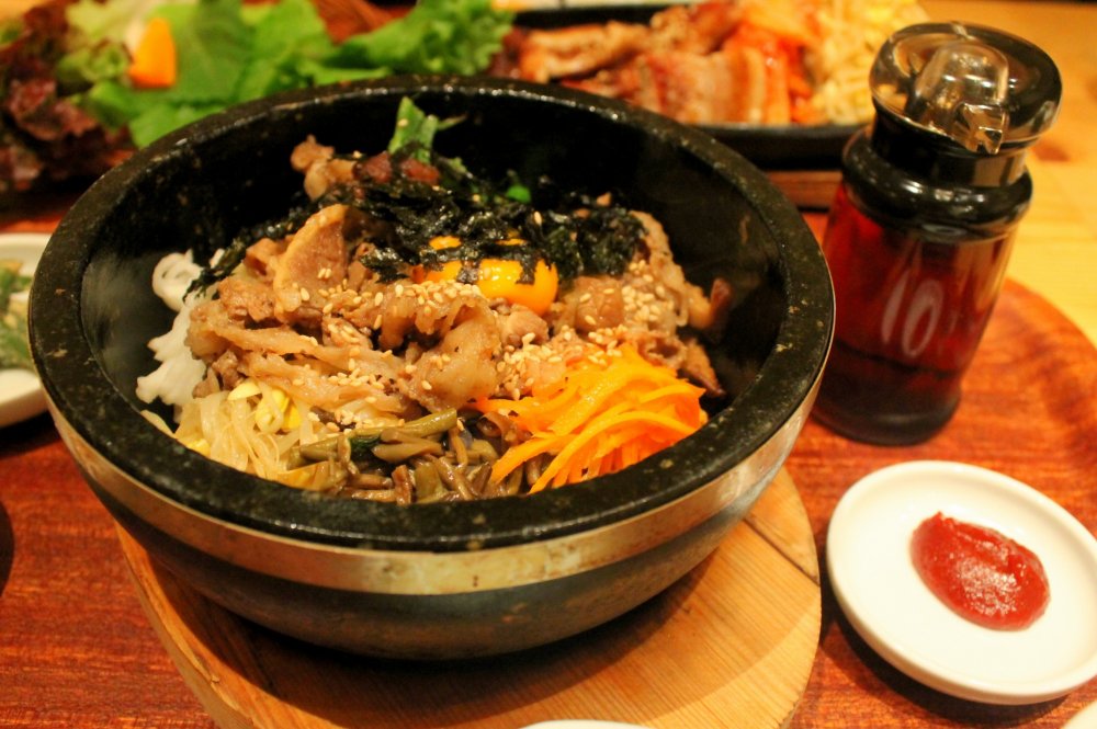 The Bibimbap set complete with several kinds of side dishes including kimchi.
