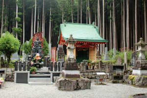 A monument and statue of Fudomyo-sama,the Buddhist deity of discipline