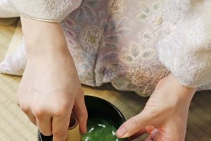 Whisking powdered green tea in Tea Ceremony Koto