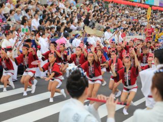 Dance of children with red Happi and Hachimaki (Headbands)