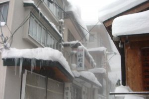 Icicles grow long from the roofs of the houses in Zao Onsen in winter