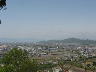 Mt. Kinka off to the right, two skyscrapers in downtown Gifu City off to the left, and the mountain range of Shiga Prefecture in the distance.