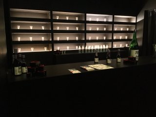 The chic sake bar, in full swing at night. 