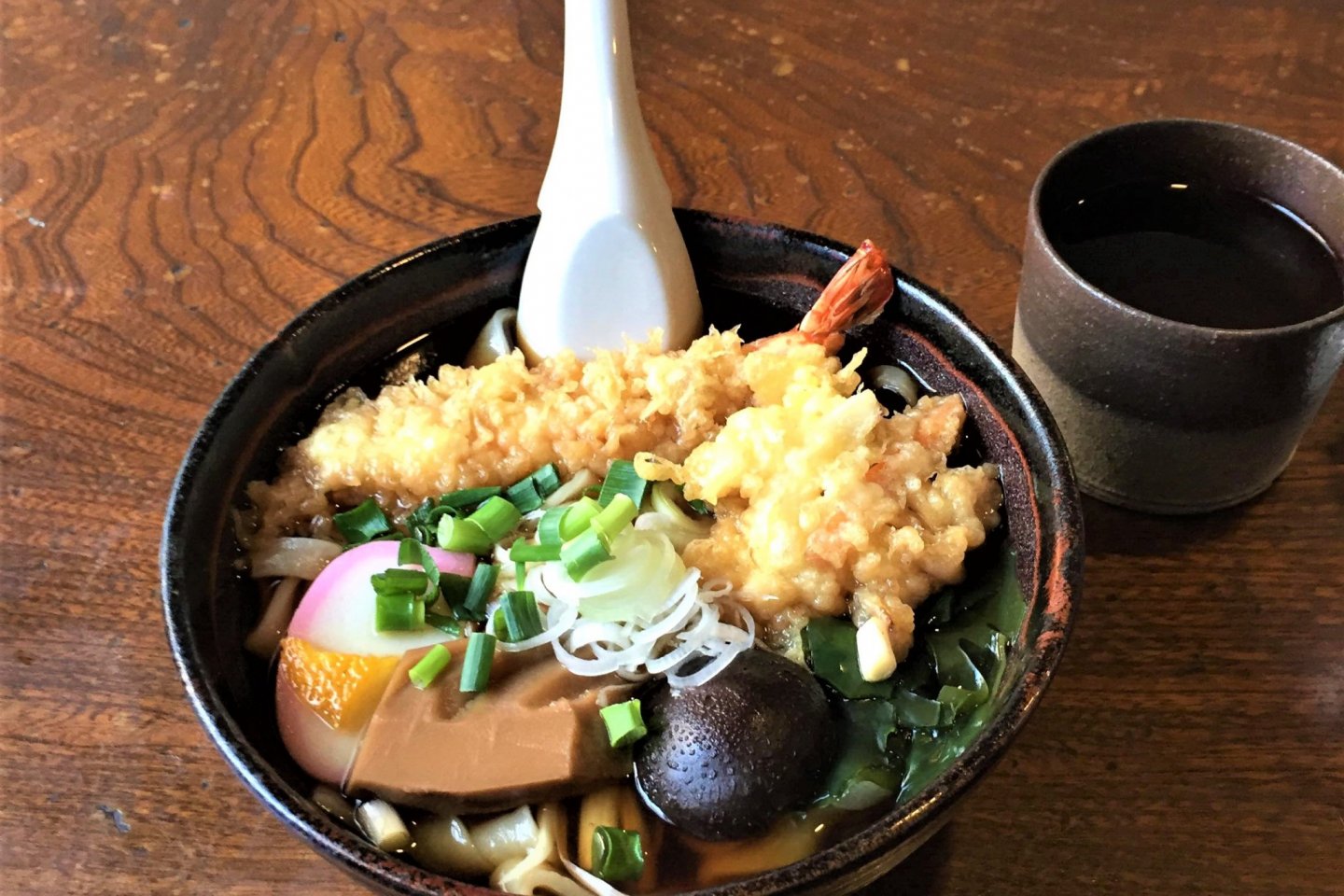 A bowl of tempura and noodles