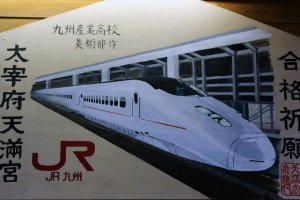 Find some JR Kyushu-themed artwork inside the station.