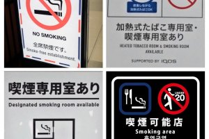 Signs at the doorway show the smoking rules that apply for each eatery