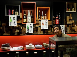 The interior of Ryougoku is simple and beautiful with Sake bottles and traditional Japanese decorations throughout