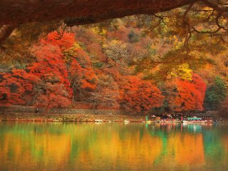 The autumn foliage and its reflection in Hozugawa river