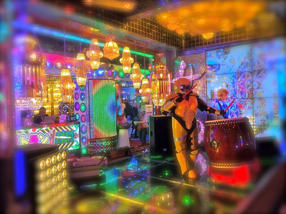 Taiko drummer entertainment while in queue for payment to the Robot Restaurant
