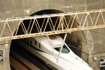 <p>The shinkansen coming out of the tunnel which starts&nbsp;near Mount Rokko and exits just before the arrival at&nbsp;Shin Kobe Station. The picture was&nbsp;taken from the hiking trail starting point of Mount Maya.</p>
