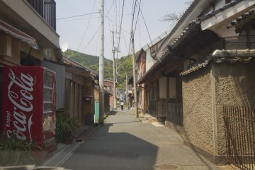 One of the very narrow streets in the crowded village of Kayoi, the width of a minicar