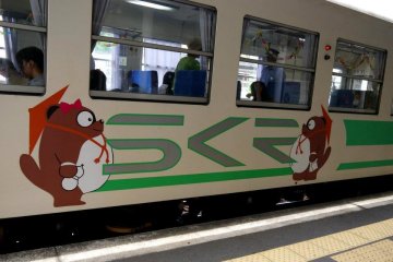 <p>The small local train is decorated with tanuki</p>