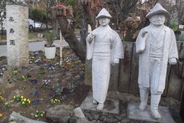 <p>These two chaps stand at the park&#39;s entrance, across the road from the station</p>