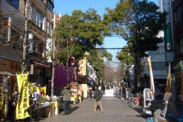 <p>No need to come inside: goods are displayed for you to browse on the stands outside the storefronts.</p>