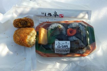<p>They offer croquettes and bento as well as onigiri.</p>