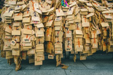 <p>These are then hung up around the shrine. Although this is a common practice at shrines across the country, they are especially plentiful at this time of year at Yushima Tenjin, with easily tens of thousands placed around the shrine grounds.</p>