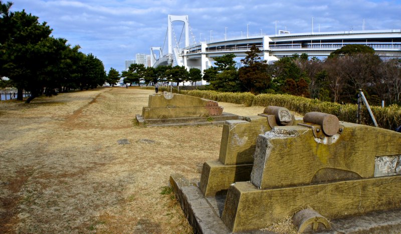 <p>The canon ruins at The Third Daiba, or Daiba Park, with the majestic Rainbow Bridge in the background</p>