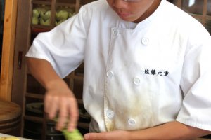 Motoshige Sato preparing wasabi.