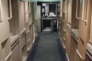 The room with the capsules is separate from the bunks and other facilities