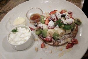 Delicious, large pancakes with plenty of fruit.