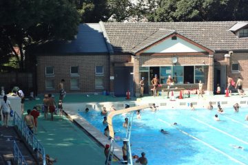 People enjoy the pool in summer