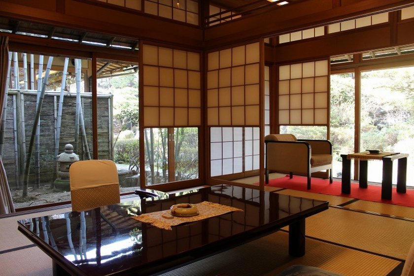 A quiet garden provides a backdrop for the beautiful Japanese style room