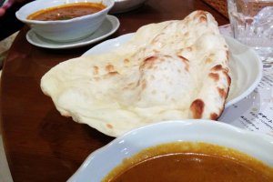 Massive naan bread and your choice of vegetable, chicken, or seafood curry.&nbsp;