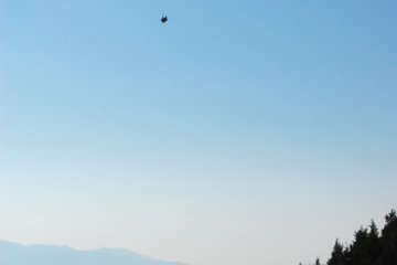 Paragliders launch from Mt Kannan.