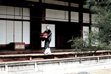 <p>Monk-in-training carrying out some tasks</p>