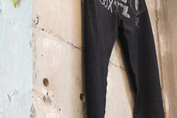 <p>Jeans with custom designs etched on.&nbsp;</p>