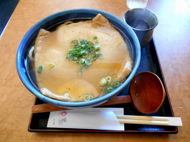 <p>Kitsune Udon (deep-fried bean curd and Japanese noodles). The size of Kitsune is very big here in Tokushima!</p>