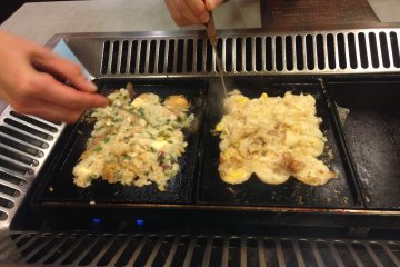 Use the picks to move the ingredients into the holes. It is easier to make your own takoyaki than you think!