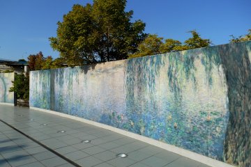 <p>Monet&#39;s Nympheas reproduced on the wall in the garden. As these ceramic boards are durable, these paintings can be displayed outdoors as well</p>
