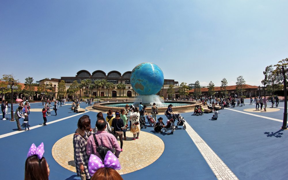 The front of the park has the world globe as a fountain and you can see the entrance to the park in the background.&nbsp;
