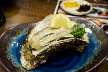 <p>This huge oyster was 1200 yen a pop, but oh man was it heavenly.</p>