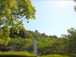 Pictured here is the monument &quot;Light, Wind and Dreams&quot; and Tateyama Castle that sits on top of the 66 meter high park.