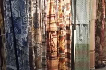 <p>Rails and rails of curtains in the main store</p>