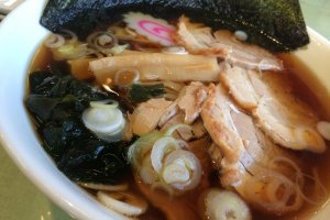 Try the Roast Pork Ramen for 800yen. It will compliment your sashimi order so well!