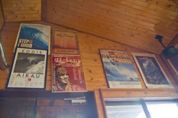 <p>Surfing posters decorate the wooden walls</p>