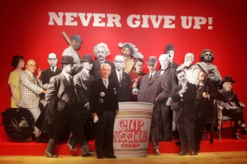 <p>คติพจน์ของ Nissin &quot;Never Give Up&quot;</p>