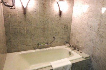 Large bathtub and marble tiles
