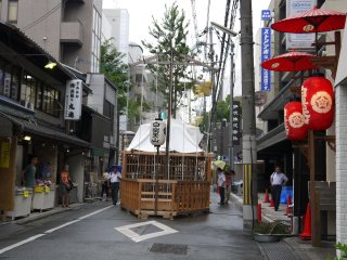 Some of the floats are decorated with live pine or bamboo branches