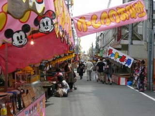 Food and amusement stalls line selected streets