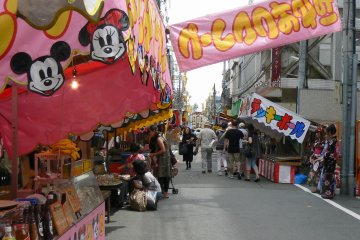 <p>Food and amusement stalls line selected streets</p>