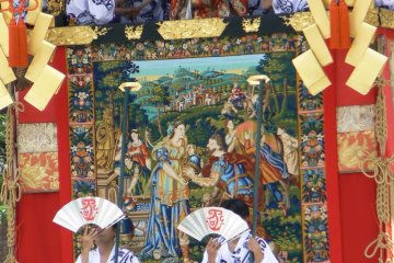 <p>Gorgeous tapestries and brocades cover the floats</p>